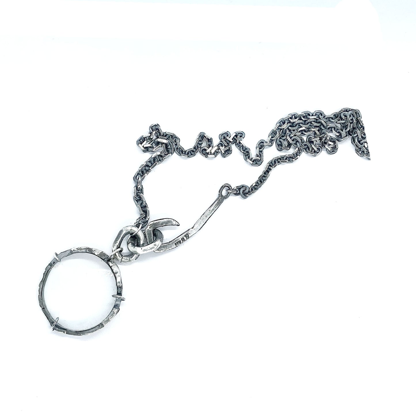 Magnifying glass silver pendant