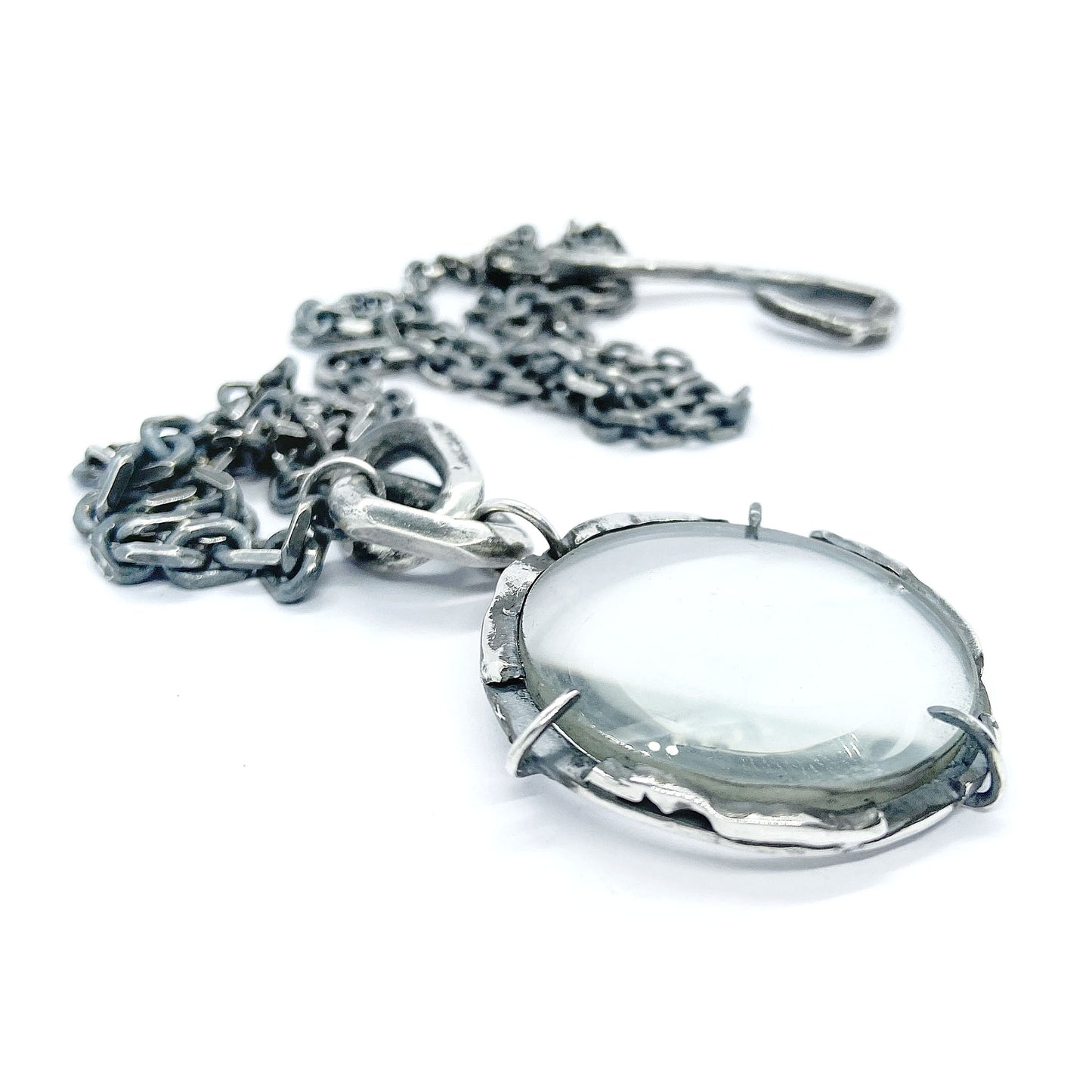 Magnifying glass silver pendant
