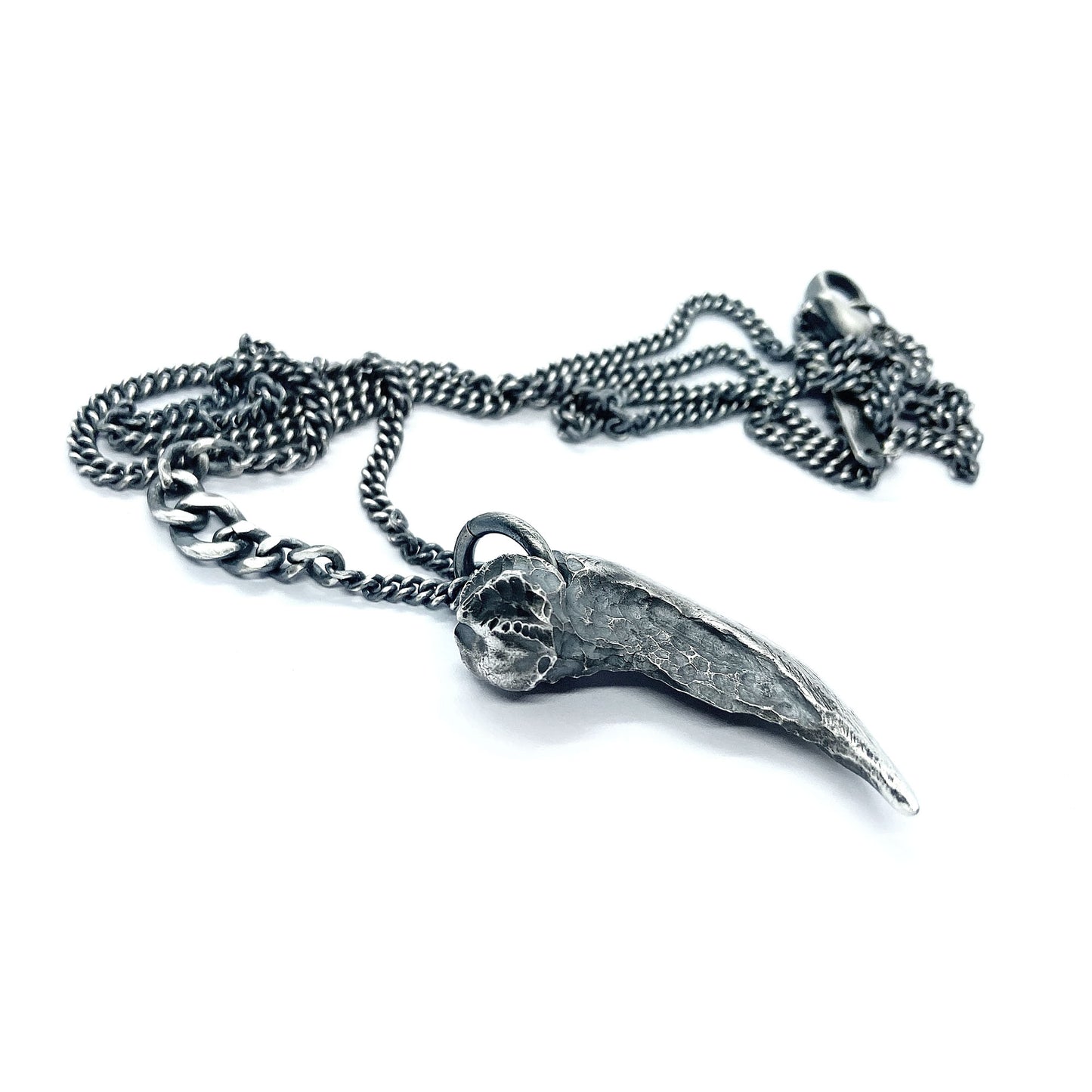 Silver claw pendant