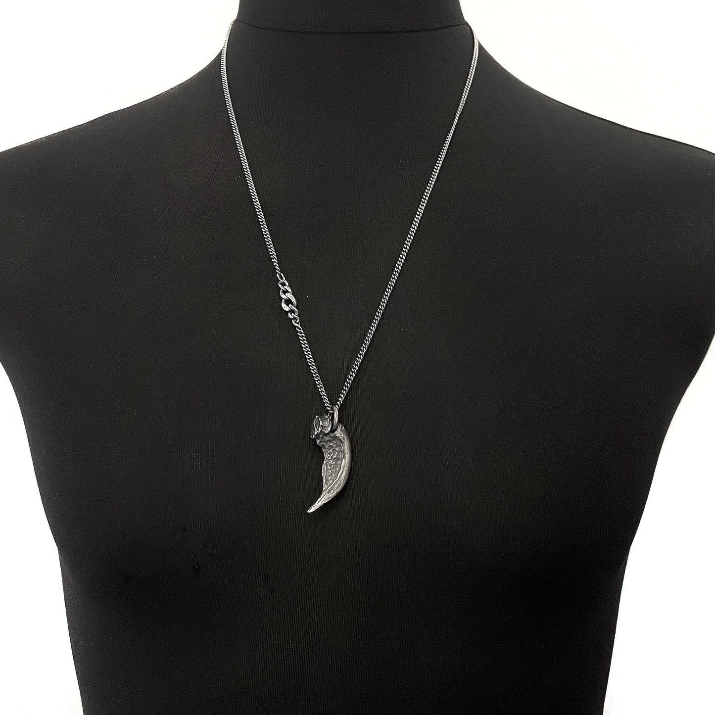 Silver claw pendant