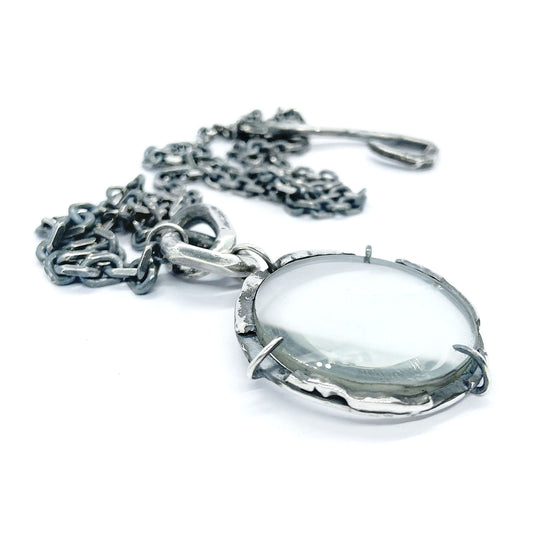 Magnifying glass silver pendant