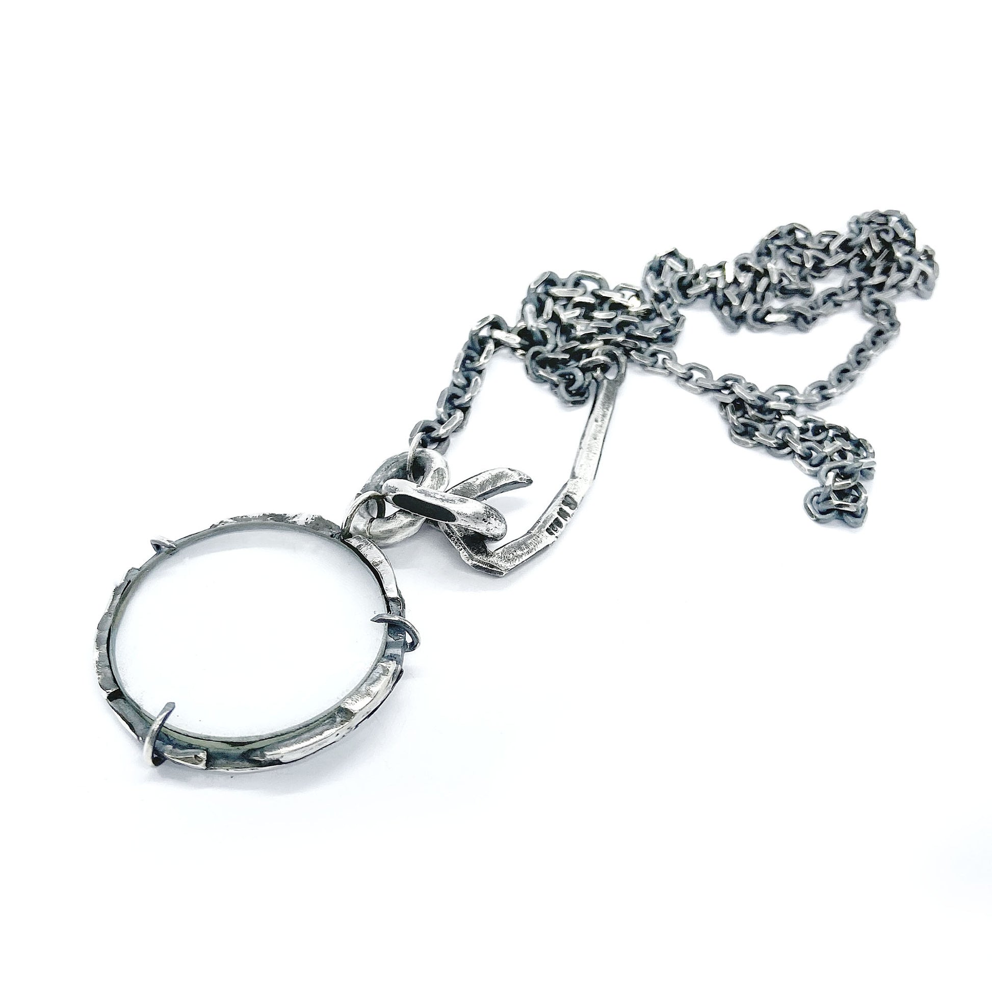 Magnifying glass silver pendant