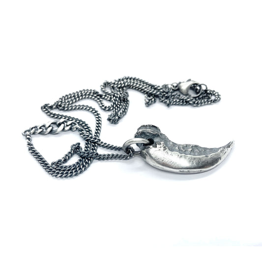 Silver claw pendant