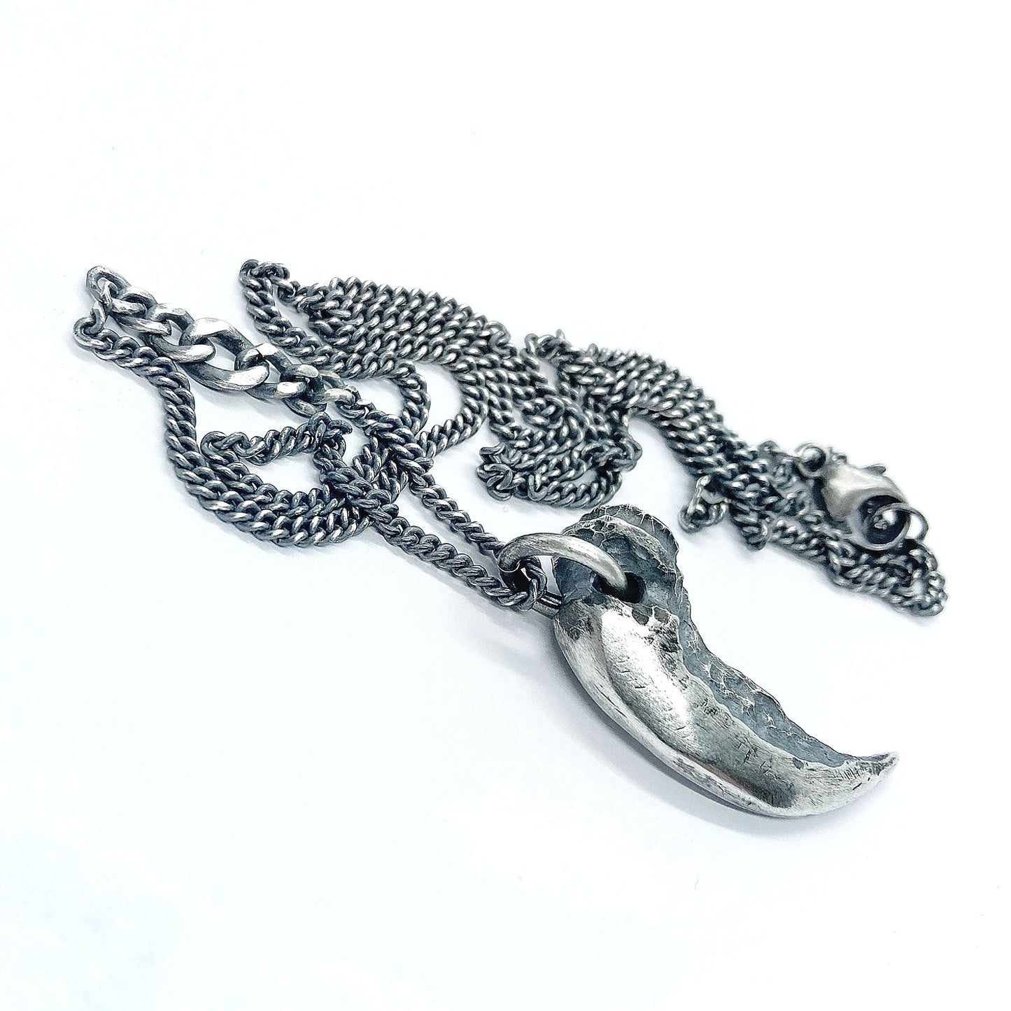Silver claw pendant